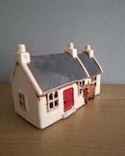 Load image into Gallery viewer, Village Pottery CROFT HOUSE with HIGHLAND COW Tea Light Holder
